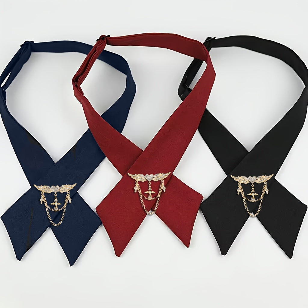 Three neckerchiefs in navy, red, and black with decorative clasp on a white background